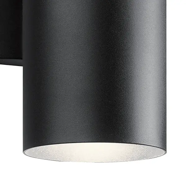 The Cylinder outdoor wall light combines contemporary design with practical functionality. Its integrated LED technology and wet-rated construction make it ideal for exposed outdoor locations, while the up/down light distribution creates dramatic architectural effects. - alternate view