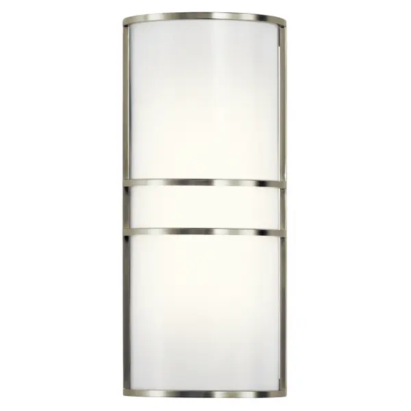 This 16-inch vertical wall sconce delivers bright, even illumination through white acrylic diffusers. The brushed nickel finish and clean lines work in both traditional and contemporary spaces. Integrated LED technology eliminates bulb replacement.