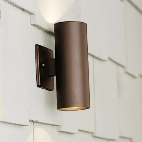 This low-profile deck light delivers functional up and down illumination in a sleek, architectural bronze finish. Wet-rated for outdoor durability with xenon lighting that blends seamlessly into modern exterior designs.