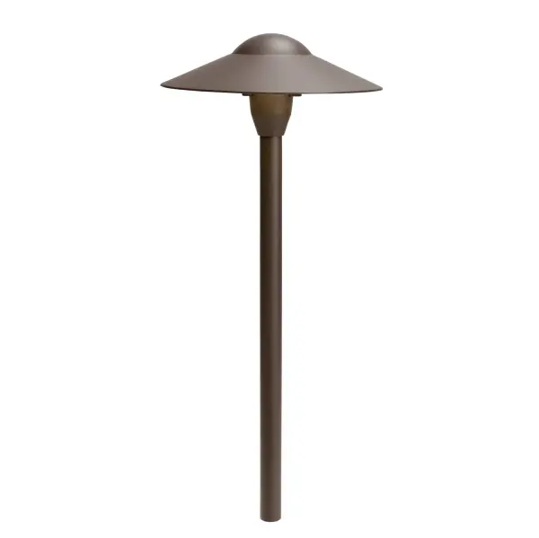 The Dome Path Light delivers functional landscape illumination with a contemporary aesthetic. Its wider spread pattern effectively lights pathways while maintaining a low profile in the landscape design.