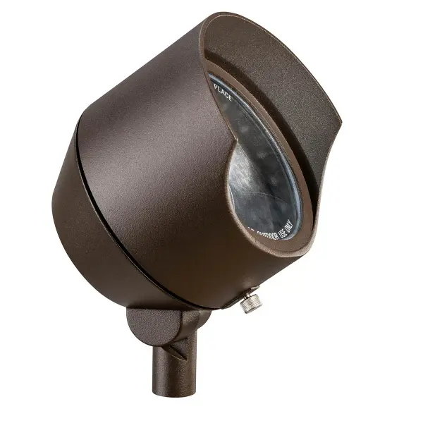This compact 12V landscape spotlight delivers focused illumination for outdoor accent lighting. The textured architectural bronze finish provides durability and aesthetic appeal for residential and commercial landscapes.
