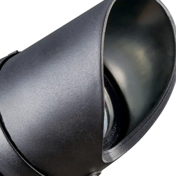 This 12V landscape spotlight delivers focused illumination for highlighting architectural features, trees, and garden elements. Its compact 6.5-inch profile and black finish blend seamlessly into outdoor settings. - alternate view