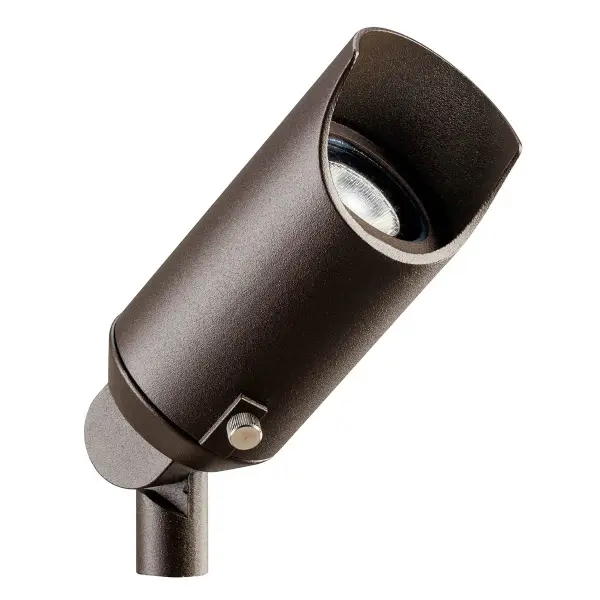 This compact 12V copper spotlight delivers focused illumination for outdoor landscapes and architectural features. Wet-rated durability with textured bronze finish complements modern and traditional exteriors alike.