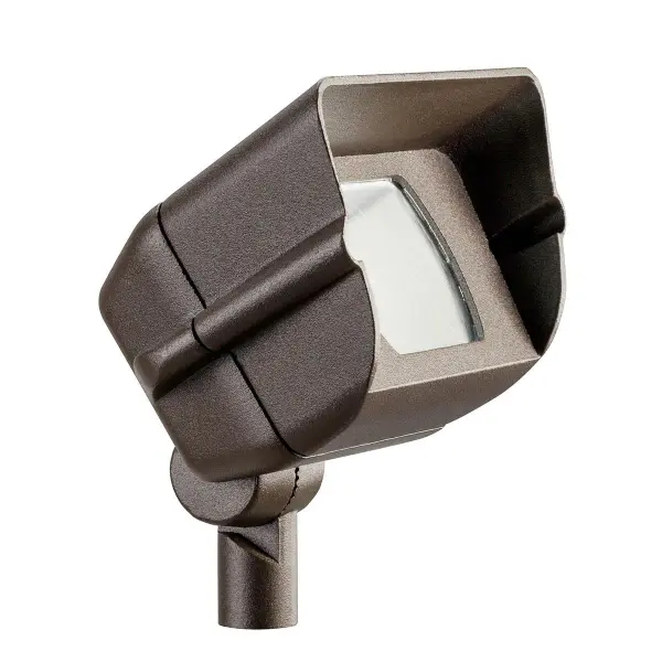 This 12V halogen flood light delivers focused illumination for outdoor landscapes and architectural features. The textured bronze finish provides durability and blends naturally with outdoor environments.