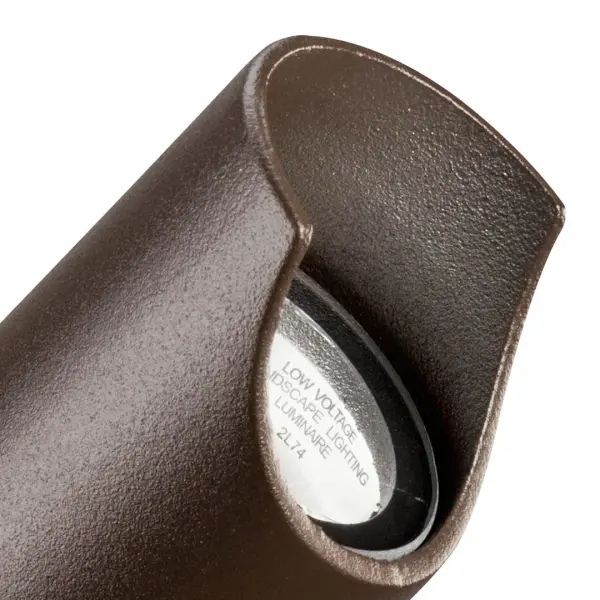 This compact 12V landscape spotlight delivers focused illumination for architectural features, landscaping, and outdoor focal points. The textured bronze finish blends naturally with outdoor environments. - alternate view