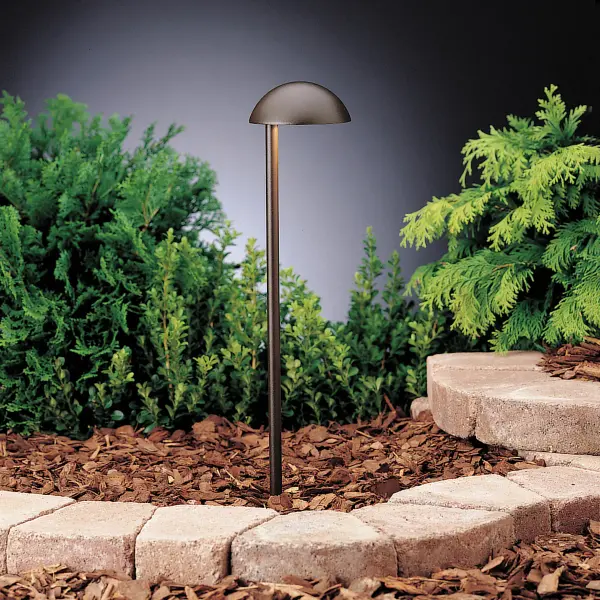 The Eclipse path light combines a popular dome cap design with side-mounting for precise directional lighting. Its compact aluminum construction and wet-rated durability make it ideal for pathways, gardens, and architectural accents.