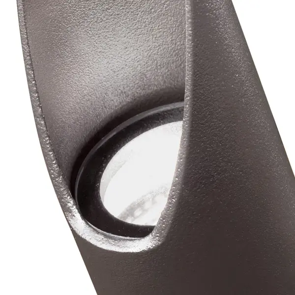 This compact 12V accent light delivers focused illumination for outdoor landscapes and architectural features. The textured bronze finish provides durability in wet conditions while the small profile allows discreet placement. - alternate view