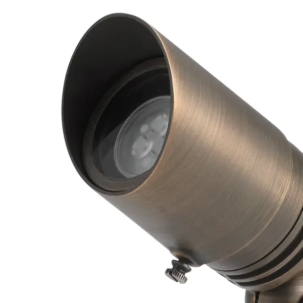 This compact 12V halogen spotlight delivers focused illumination in a durable wet-rated brass housing. Ideal for highlighting architectural features, trees, or garden focal points with traditional styling. - alternate view