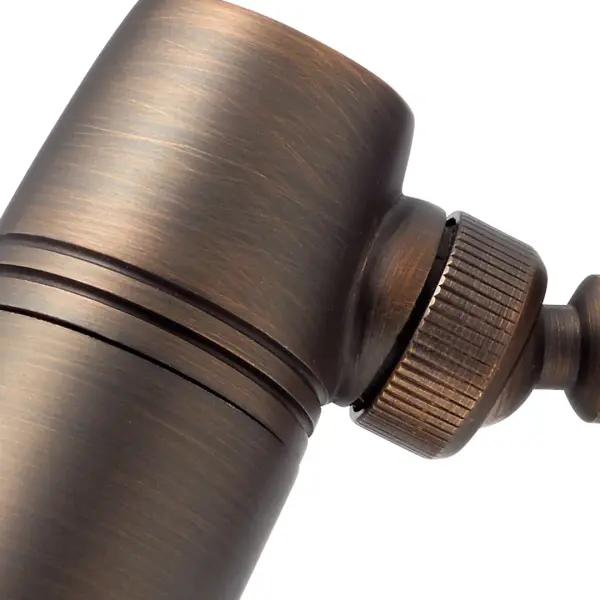 This compact 12V landscape downlight features a timeless Centennial Brass finish, perfect for highlighting architectural features, pathways, and garden elements with warm, focused illumination. - alternate view