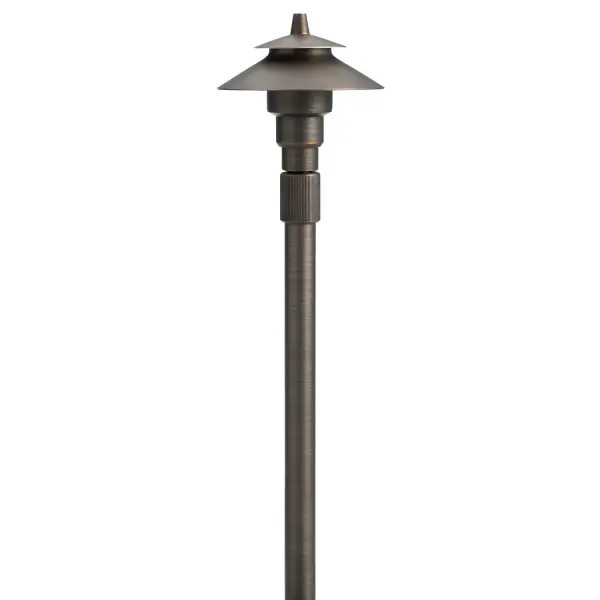 This traditional brass path light combines timeless design with practical functionality. The adjustable height feature and wet-rated construction make it ideal for illuminating walkways, gardens, and outdoor living areas.