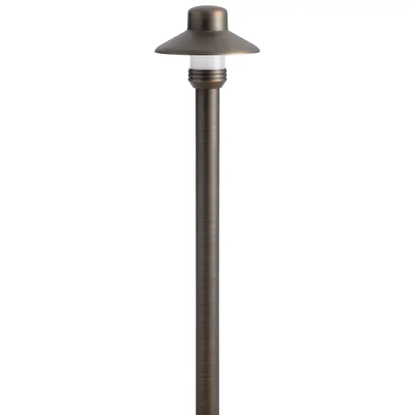 This compact dome path light combines traditional brass craftsmanship with practical outdoor lighting. The Centennial Brass finish offers warm, timeless appeal while the clear tempered glass ensures durability in all weather conditions.