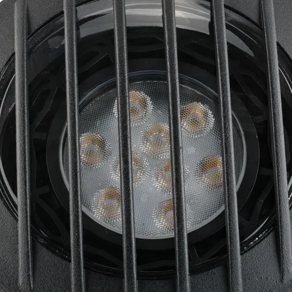 This compact in-ground accent light combines contemporary black brass styling with practical 12V operation. Perfect for highlighting architectural features, pathways, or garden focal points with wet-rated durability. - alternate view