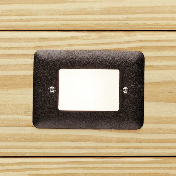 This compact 12V LED step light provides efficient, wet-rated illumination for decks, patios, and stairs. The textured architectural bronze finish offers durability and subtle style for outdoor spaces. - alternate view