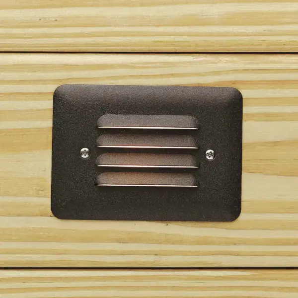 This compact step light delivers warm, even illumination for outdoor stairs and walkways. The louvered design minimizes glare while the integrated LED provides 40,000 hours of maintenance-free operation.