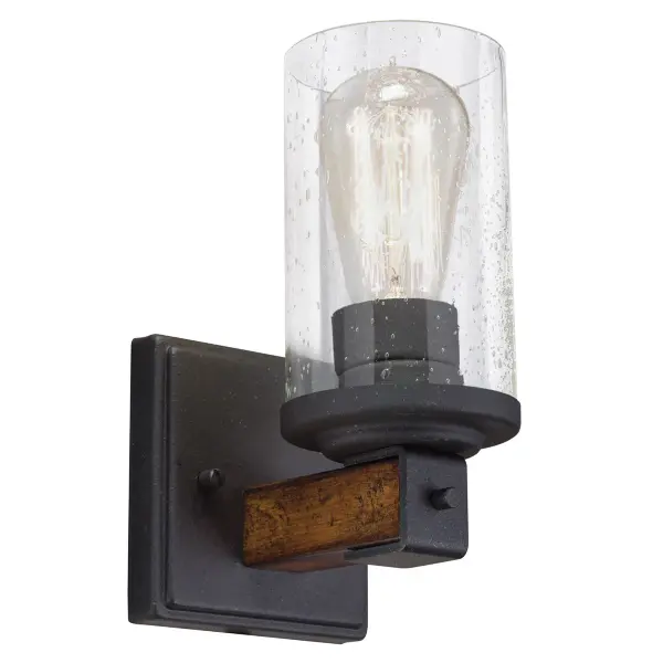 The Barrington Wall Sconce combines distressed black finish with clear seeded glass for authentic farmhouse appeal. Its compact 8.69" height makes it ideal for smaller spaces while the up-or-down mounting flexibility adds versatility.