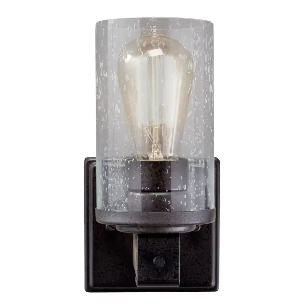 The Barrington Wall Sconce blends rustic farmhouse warmth with industrial character. Featuring distressed wood accents, anvil iron finish, and clear seeded glass, this compact fixture adds authentic charm to any space. - alternate view
