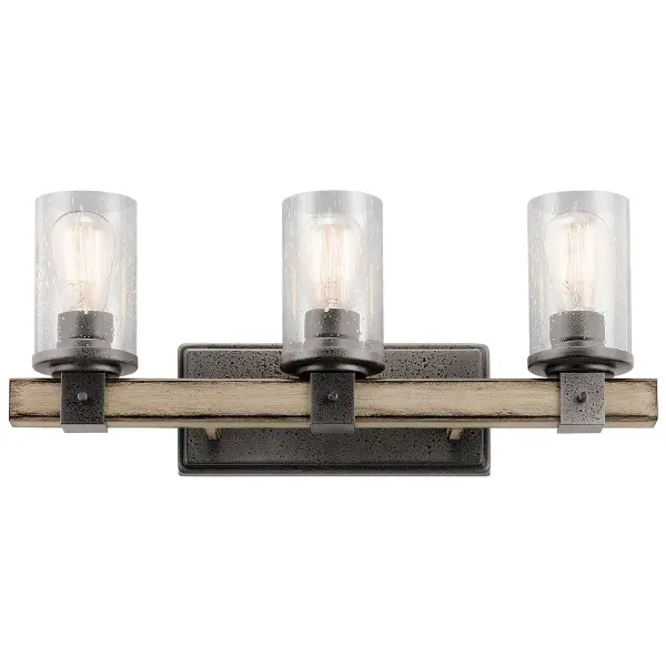 The Barrington 3-Light Vanity Light combines rustic industrial style with practical bathroom illumination. Its anvil iron finish and clear seeded glass shades create character while providing ample light for grooming tasks. - alternate view