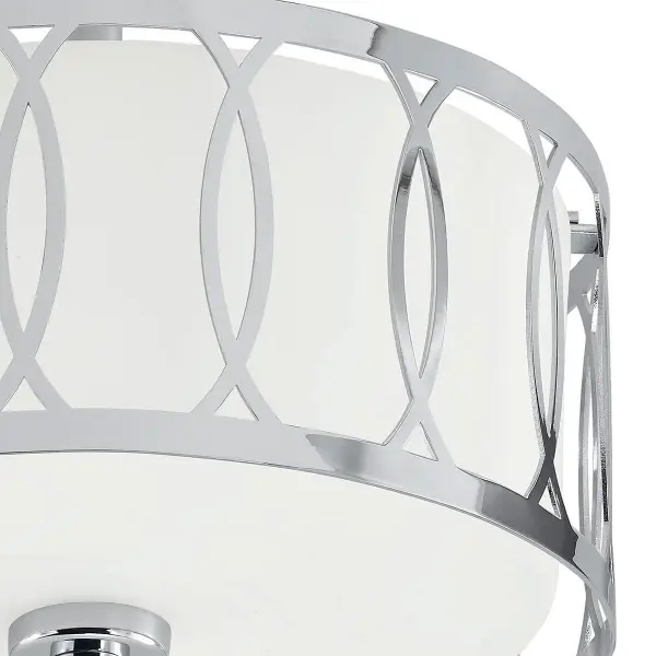 This 2-light semi-flush mount offers a sleek chrome finish and compact 12.25-inch diameter, making it ideal for smaller spaces. Dimmable halogen bulbs provide adjustable lighting for versatile ambiance. - alternate view