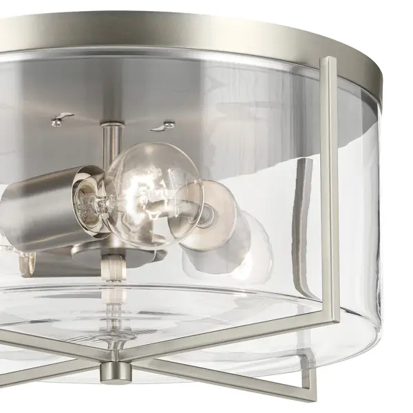 The Birk 3-light flush mount combines transitional styling with practical functionality. Its 14-inch diameter and clear glass shades provide ample illumination while the brushed nickel finish adds refined elegance to any space. - alternate view