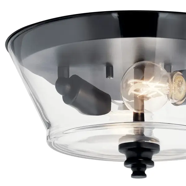 The Ashba 2-light flush mount combines contemporary black metal with clear glass for a clean, versatile look. Its compact 13-inch diameter and low 6.5-inch profile make it ideal for rooms with standard ceiling heights. - alternate view