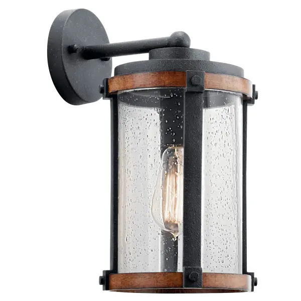 The Barrington Outdoor Wall Light combines farmhouse aesthetics with practical outdoor lighting. Its distressed black finish and clear seeded glass create vintage appeal while providing reliable illumination for entryways and patios.