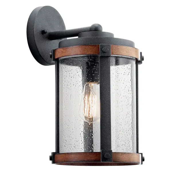 The Barrington Outdoor Wall Light combines farmhouse aesthetics with practical outdoor lighting. Its distressed black finish and clear seeded glass create vintage appeal while providing reliable illumination for entryways and patios.