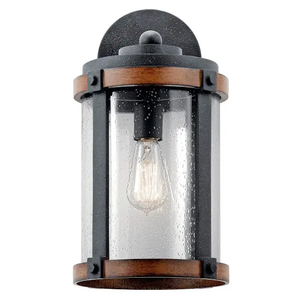 The Barrington Outdoor Wall Light combines farmhouse aesthetics with practical outdoor lighting. Its distressed black finish and clear seeded glass create vintage appeal while providing reliable illumination for entryways and patios. - alternate view