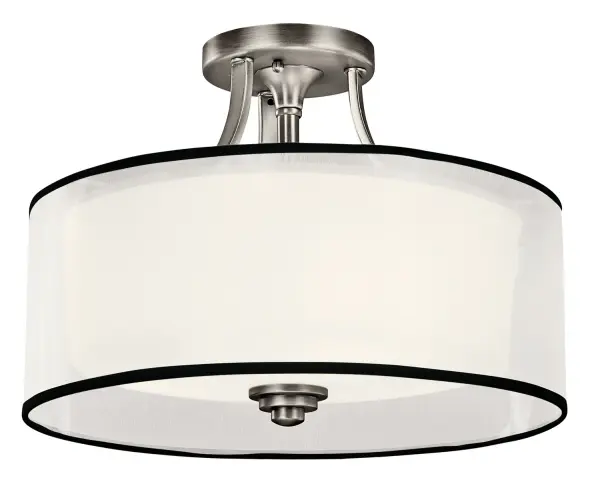 The Lacey semi-flush combines traditional elegance with practical functionality. Its Venetian-inspired curved details in antique pewter finish pair beautifully with layered shades that create warm, diffused ambient lighting.