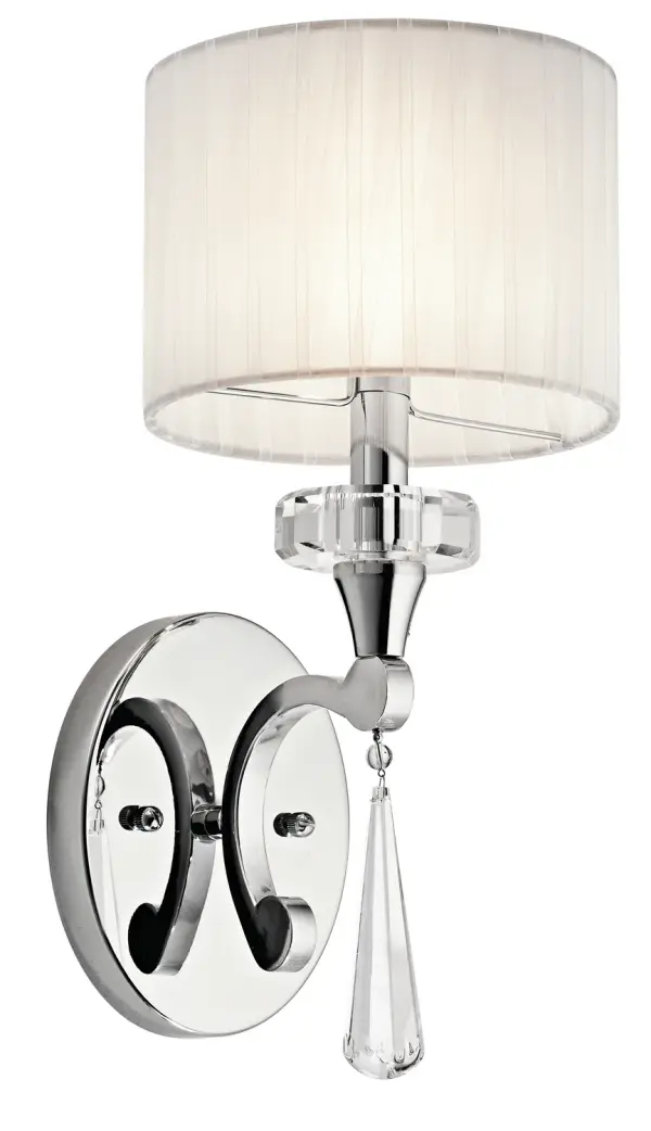 The Parker Point wall sconce combines polished chrome with optical crystal accents and an organza shade for sophisticated ambient lighting. Its compact 6.75" width makes it ideal for flanking mirrors or tight spaces.