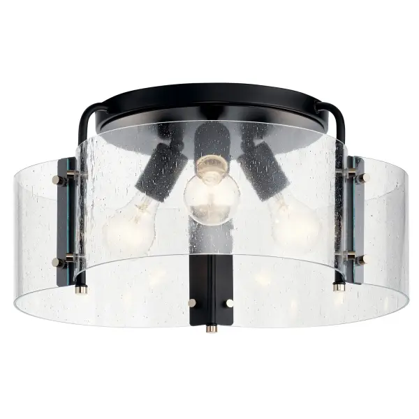 The Thoreau semi-flush mount delivers industrial style through exposed bolt details and seeded glass shades in a compact 18-inch profile. Its low-profile design suits standard ceiling heights while providing ample illumination.