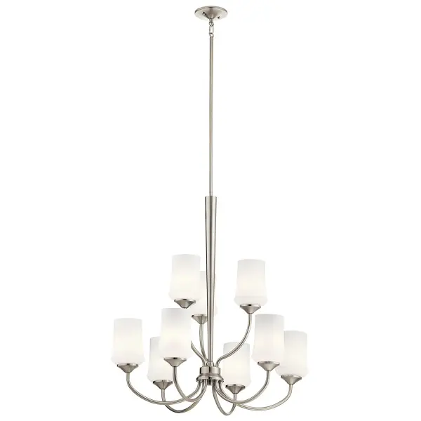 The Aubrey 9-light chandelier combines classic multi-tier design with contemporary brushed nickel finish and satin etched opal glass shades. At nearly 29 inches wide and 31 inches tall, it makes a substantial statement in dining rooms and foyers. - alternate view