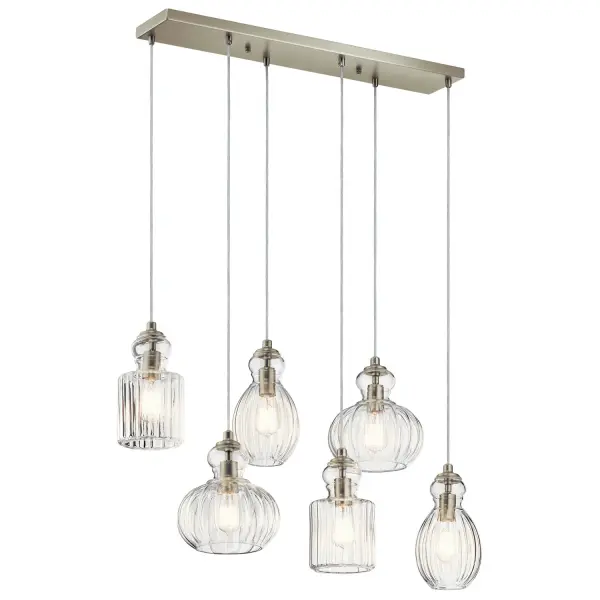 The Riviera linear chandelier brings vintage perfume bottle elegance to modern spaces with its brushed nickel finish and distinctive ribbed glass shades. At 35.5 inches, it's perfectly proportioned for kitchen islands and dining tables.