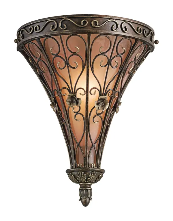 The Marchesa wall sconce brings Old World charm with its intricately detailed basket design featuring swirling textures and botanical accents. The Terrene Bronze finish and seeded glass create warm, ambient lighting perfect for traditional interiors.