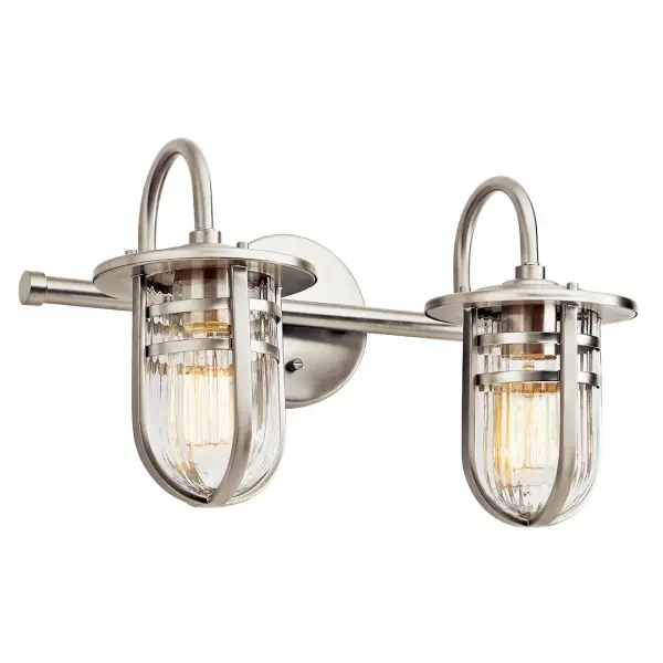 The Caparros 2-light vanity fixture combines transitional styling with functional bathroom lighting. Its brushed nickel finish and ribbed glass shades provide both visual interest and practical illumination for vanity areas.
