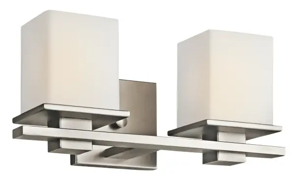 The Tully vanity light delivers modern sophistication with its angular geometric form and soft opal glass. Its neutral pewter finish and compact 15-inch width make it adaptable across traditional to contemporary bathrooms.