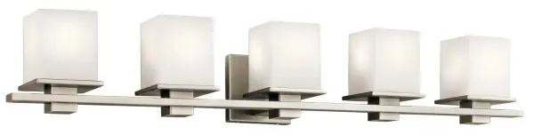 The Tully vanity light combines contemporary geometric styling with versatile appeal. Its 40.25-inch width makes it ideal for double vanities, while the antique pewter finish and satin etched glass provide refined illumination without harsh glare.