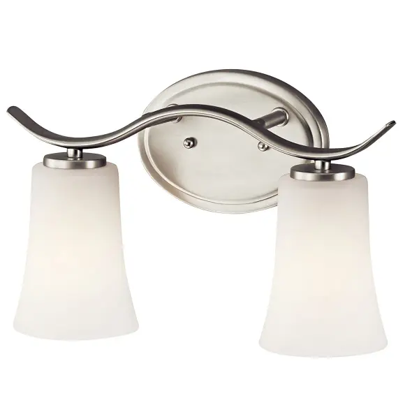The Armida 2-light vanity fixture combines transitional styling with practical features. Its brushed nickel finish and clear satin etched glass shades provide even illumination, while dimmable capability and damp rating make it suitable for various bathroom environments.