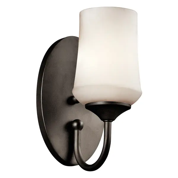 The Aubrey Wall Sconce combines traditional styling with practical functionality. Its compact 10.75" height and satin etched opal glass shade provide soft, diffused lighting perfect for hallways and bathrooms.