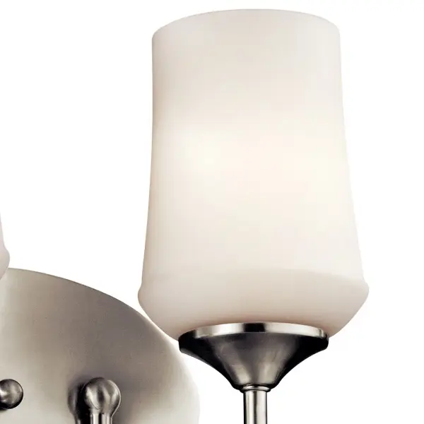 The Aubrey vanity light combines transitional styling with practical functionality. Its 29-inch width provides excellent illumination for medium to large vanities, while the satin etched opal glass diffuses light beautifully. - alternate view