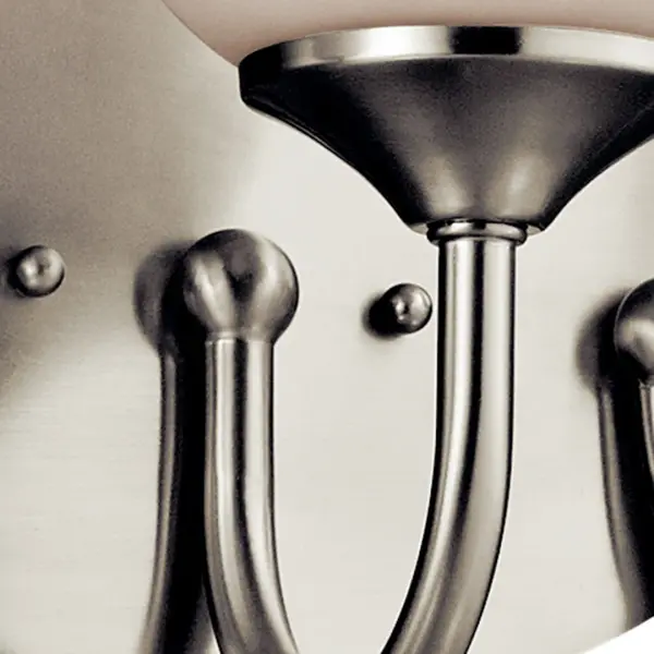 The Aubrey 3-Light Vanity Light combines timeless design with practical functionality. Its brushed nickel finish and satin etched opal glass shades provide soft, even illumination perfect for bathroom tasks. - alternate view