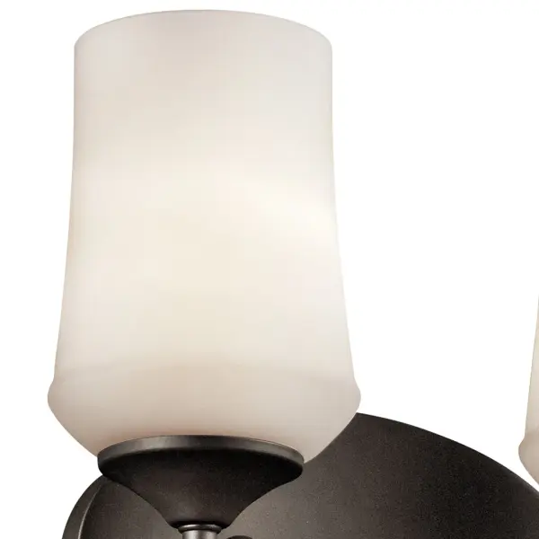 The Aubrey vanity light combines traditional styling with practical functionality. Its 29-inch width provides excellent illumination for medium to large vanities, while the Olde Bronze finish and satin etched glass create a warm, inviting ambiance. - alternate view