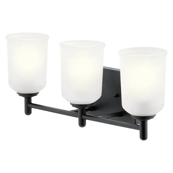 The Shailene vanity light combines transitional styling with practical features. Its 21-inch width accommodates medium vanities, while clear satin etched glass provides even illumination. Dimmable and damp-rated for bathroom use.