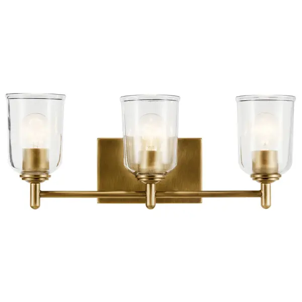 The Shailene 3-Light Vanity Light combines transitional styling with practical functionality. Its natural brass finish and clear glass shades create a sophisticated look, while dimmable capability and damp rating ensure versatility. - alternate view