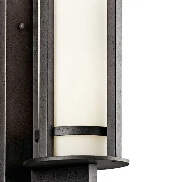 The Camden 3-light outdoor wall sconce combines classic design with modern durability. Its substantial 26-inch height and Anvil Iron finish create a commanding presence, while satin etched opal glass provides warm, diffused illumination. - alternate view