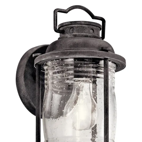 The Ashland Bay brings nautical charm to outdoor spaces with its weathered zinc finish and clear seeded glass. Compact at 11" tall, it's perfect for flanking doors or illuminating pathways with wet-rated durability. - alternate view