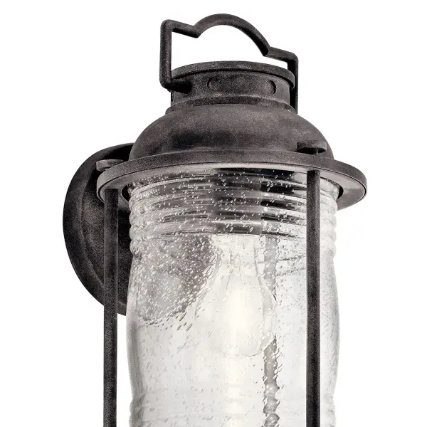 The Ashland Bay brings nautical charm to outdoor spaces with its weathered zinc finish and clear seeded glass. Perfect for coastal and transitional homes, this dimmable fixture combines durability with timeless style. - alternate view