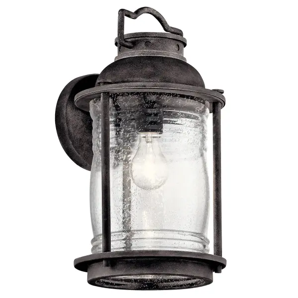 The Ashland Bay brings timeless nautical elegance to outdoor spaces with its weathered zinc finish and clear seeded glass. Wet-rated for harsh conditions, this compact wall light delivers reliable illumination with dimmable control.