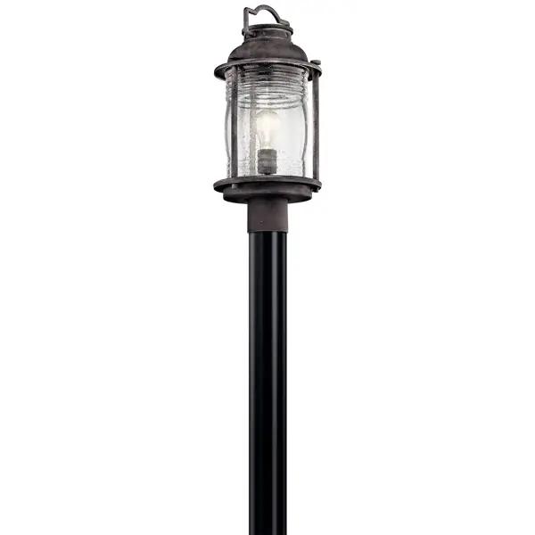 The Ashland Bay brings timeless nautical charm to outdoor spaces with its weathered zinc finish and clear seeded glass. Wet-rated for durability, this compact post light delivers reliable illumination with traditional styling.