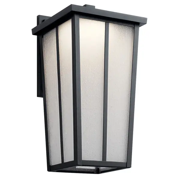 The Amber Valley combines transitional styling with modern LED efficiency. Its textured black finish and seeded glass create ambient lighting perfect for entryways and outdoor living spaces. Wet-rated for all weather conditions.