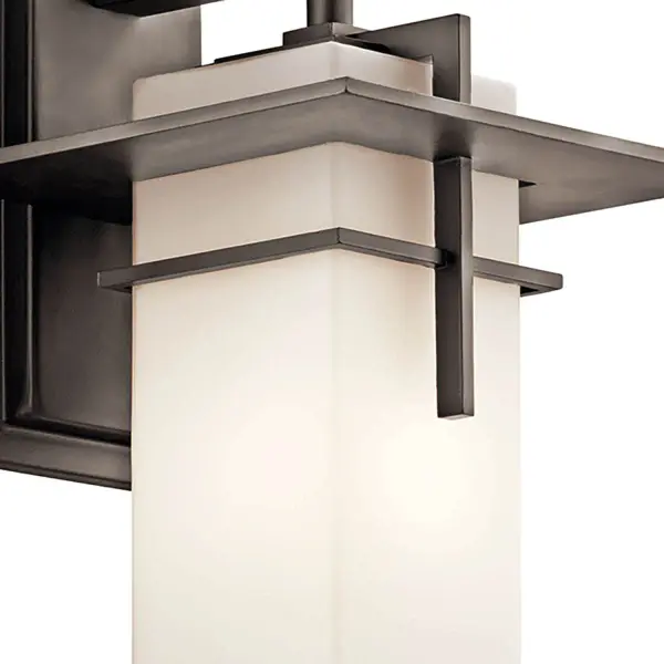 The Caterham outdoor wall light combines traditional styling with modern wet-rated durability. Its Olde Bronze finish and satin etched glass create warm, welcoming illumination for entryways and outdoor living spaces. - alternate view